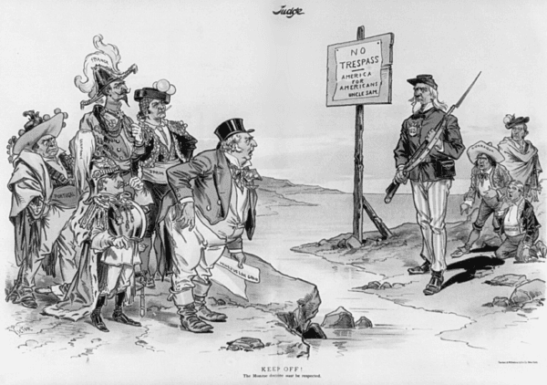In Victor Gillam's 1896 political cartoon, Uncle Sam stands with a rifle between the outrageously dressed European figures and the native-dress-wearing representatives of Nicaragua and Venezuela. (Public Domain)