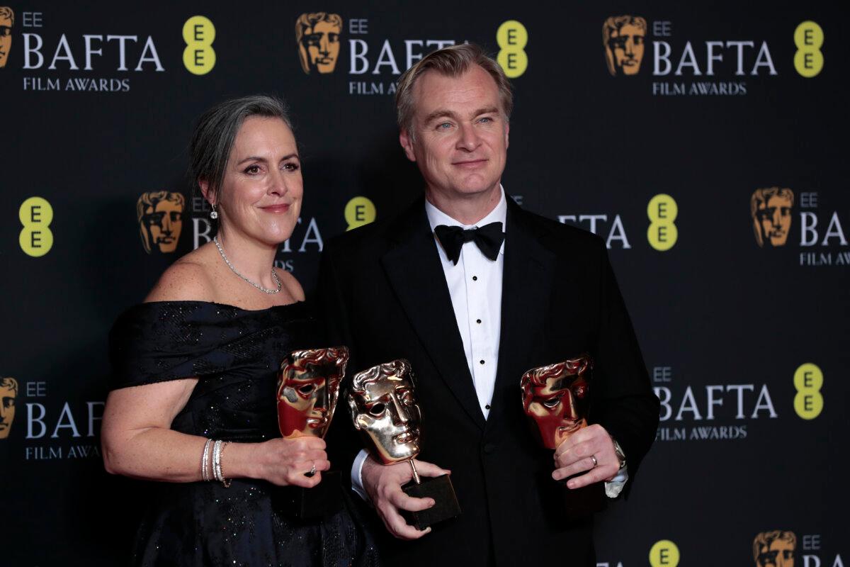 Christopher Nolan with his wife Emma Thomas, who is often a producer on Nolan’s films, pose with the Best Film Award for “Oppenheimer” during the EE BAFTA Film Awards in London on Feb. 18, 2024. (John Phillips/Getty Images)