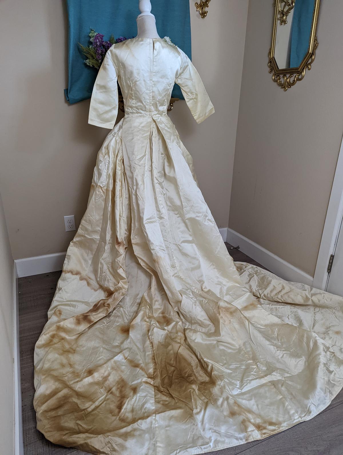 The dress had hard-to-clean stains that made the restoration process even more challenging. (Courtesy of <a href="https://www.instagram.com/hobbybobbins/">Hobby Bobbins</a>)