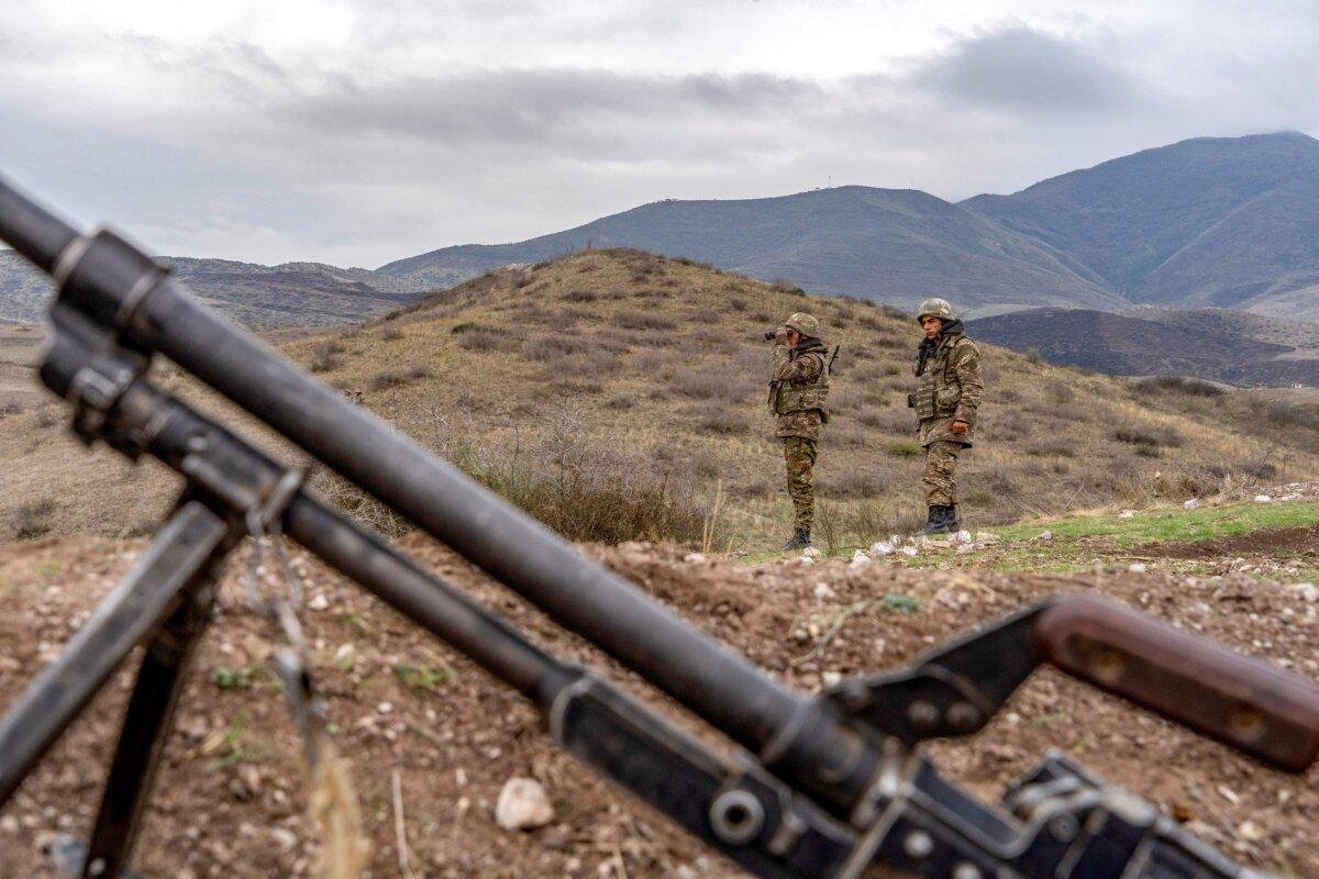 Armenian soldiers patrol at the checkpoint near a demarcation line outside Askeran after Armenia and Azerbaijan agreed on a Russian-brokered ceasefire on Nov. 9, 2020, ending six weeks of fighting in the self-proclaimed republic, on Nov. 21, 2020. (Andrey Borodulin/AFP via Getty Images)