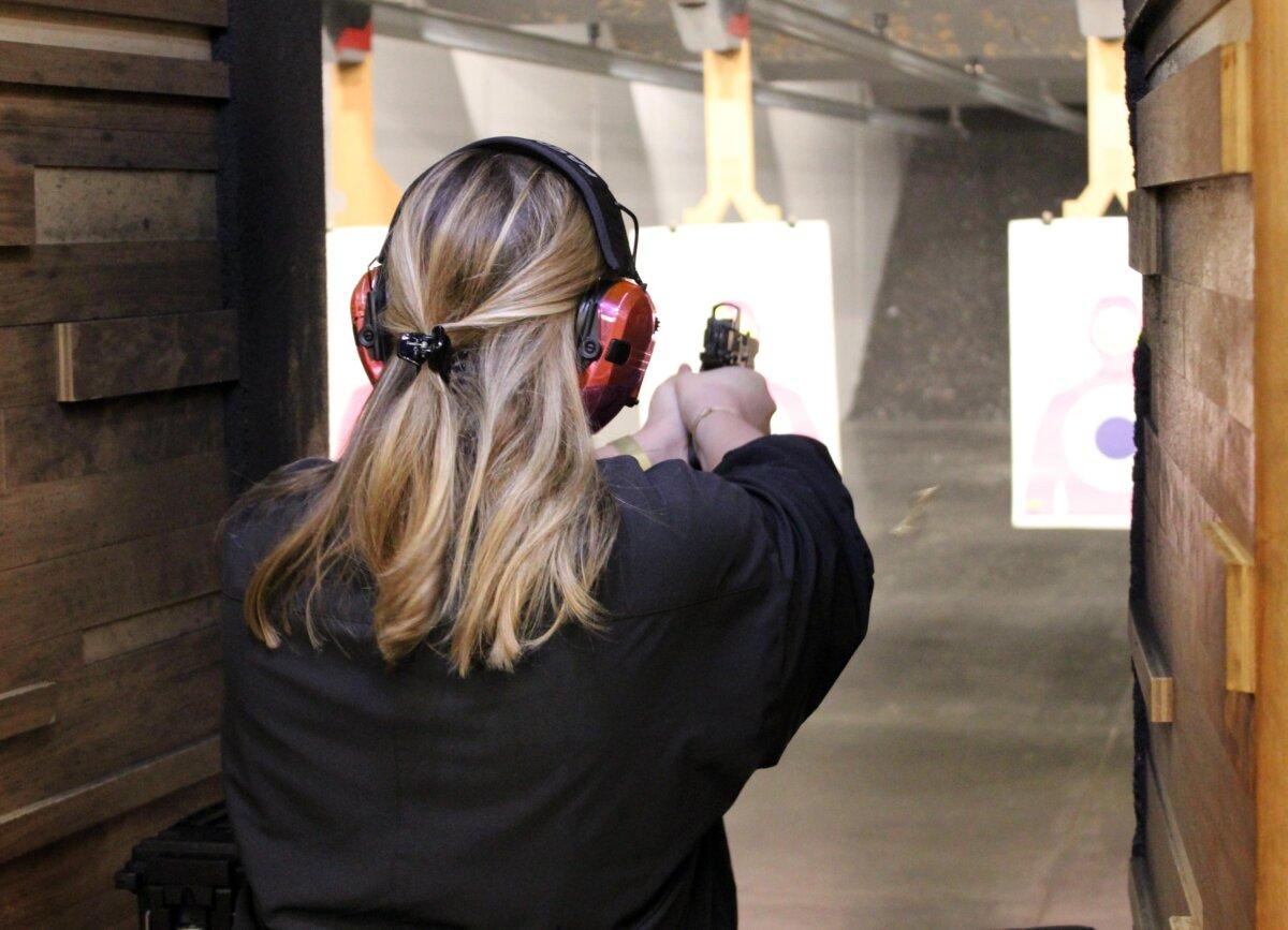 Hannah Schildcrout, of Dallas, Texas, takes aim during the National Women's Range Day at Texas Gun Experience on March 9, 2024. The event was sponsored by Gun Owners of America and Epowered2A. (Michael Clements/The Epoch Times)