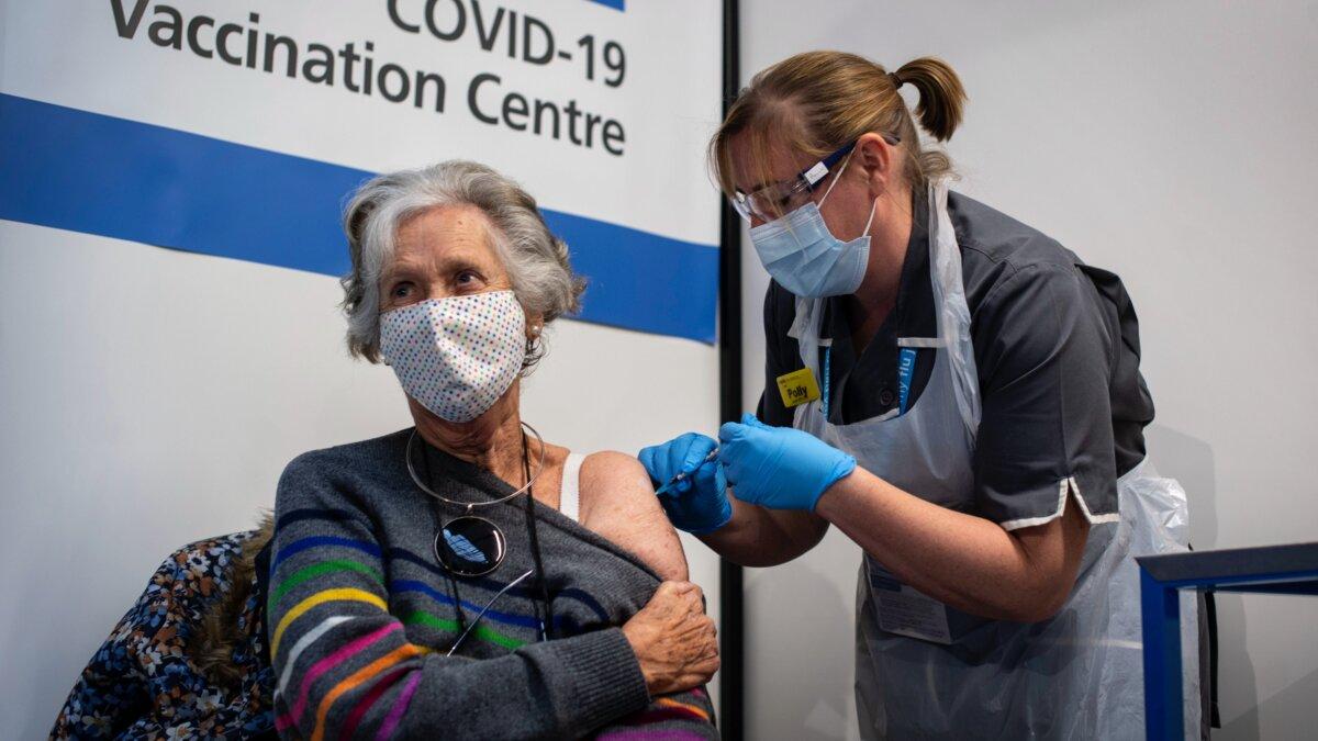 Doreen Brown, 85, receives the first of two Pfizer/BioNTech COVID-19 vaccine jabs at Guy's Hospital at the start of the largest ever immunisation programme in the UK's history, in London on Dec. 8, 2020. (Victoria Jones - Pool / Getty Images)