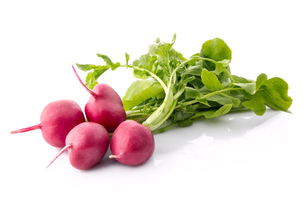 You can be eating your spring radishes less than a month after planting them, even in the early spring. (Lucky Business/Shutterstock)