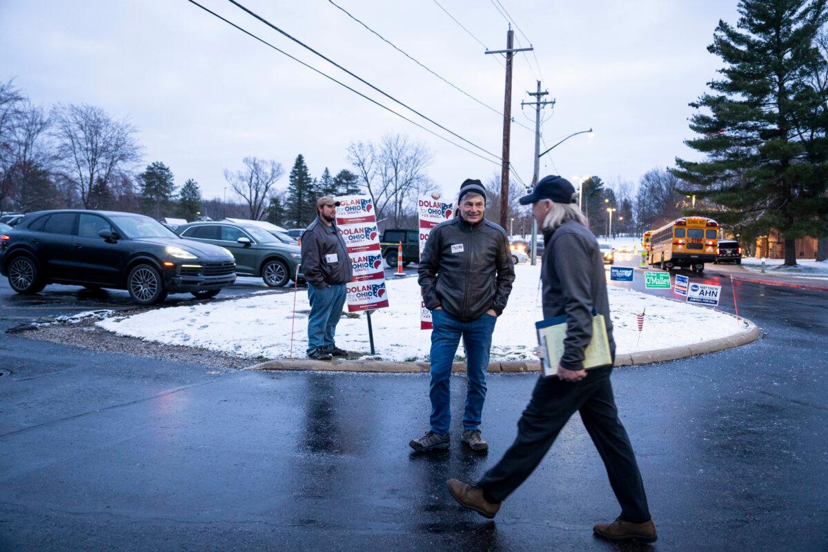 Matt Dolan, a Republican Senate candidate, meets voters right after the poll site opens at Chagrin Falls High School in Chagrin Falls, Ohio, on March 19, 2024. (Madalina Vasiliu/The Epoch Times)