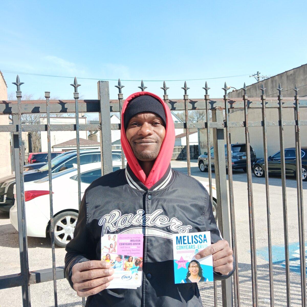 Oris Allen, a volunteer for congressional candidate Melissa Conyears-Ervin, near a polling place on Chicago's West Side on March 19, 2024. (Nathan Worcester/The Epoch Times).