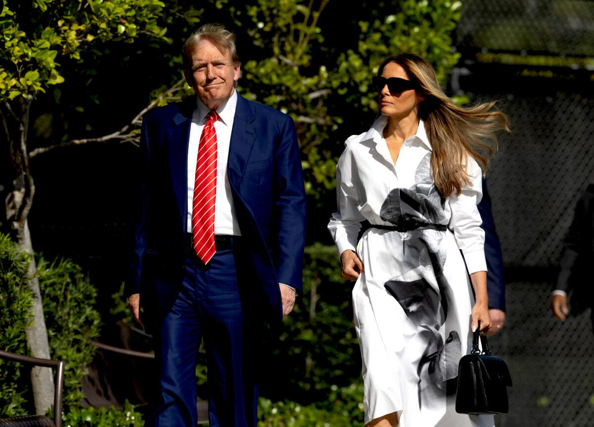 Former President Donald Trump and former First Lady Melania Trump walk together as they prepare to vote at a polling station setup in the Morton and Barbara Mandel Recreation Center in Palm Beach, Fla., on March 19, 2024. (Joe Raedle/Getty Images)