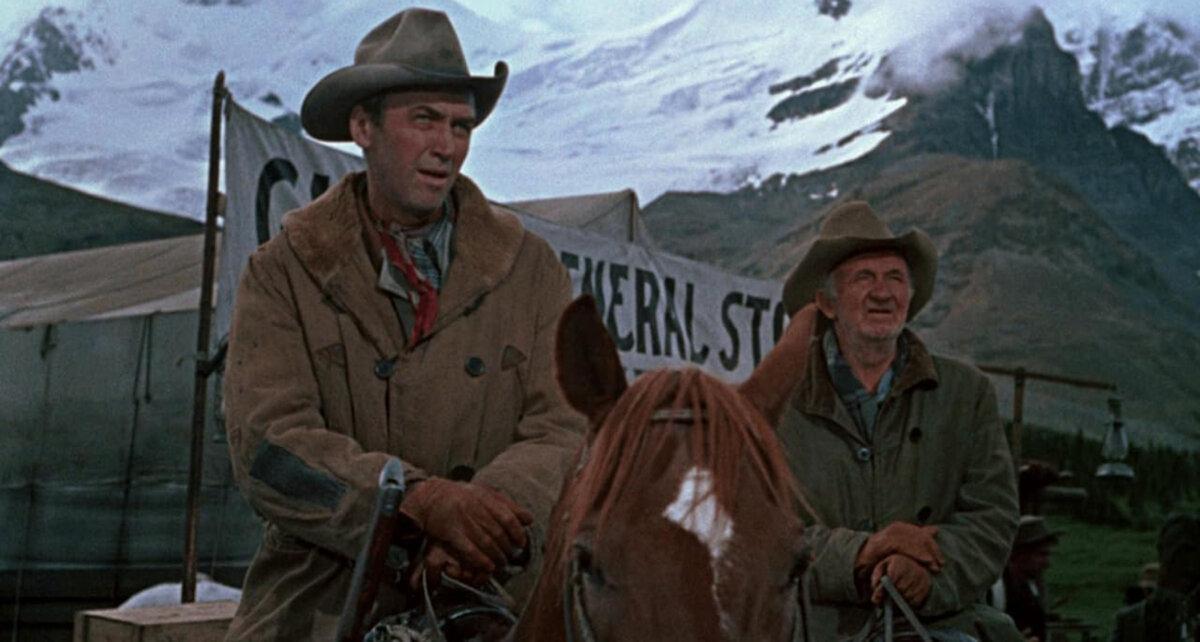 Jeff Webster (James Stewart, L) and his friend Ben Tatum (Walter Brennan) aim to strike it rich, in “The Far Country.” (Universal Pictures)