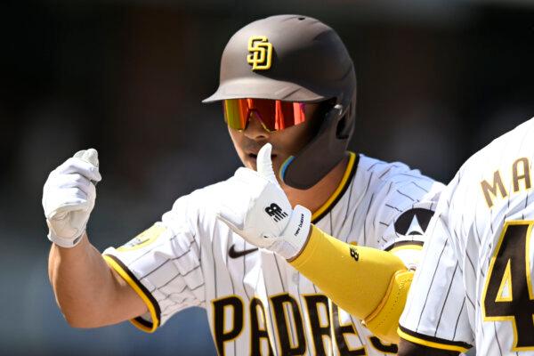 San Diego Padres shortstop Ha-Seong Kim gestures after hitting a single during a game against the San Francisco Giants in San Diego on March 28, 2024. (Denis Poroy/AP Photo)