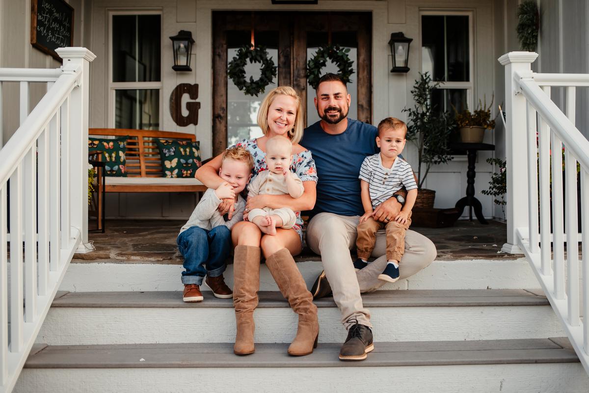 Mr. and Mrs. Grandchamp with their kids outside their 200-year-old house. (Courtesy of Megan Leech)