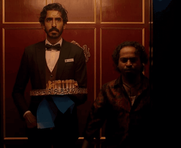 Kid (Dev Patel, L) and Alphonso (Pitobash), in "Monkey Man." (Universal Pictures)