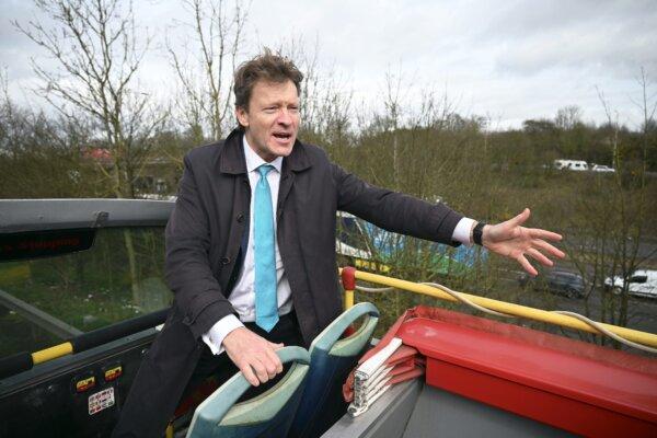 Reform UK leader Richard Tice speaks to guests on the campaign bus in Kirkby in Ashfield, England, on March 15, 2024. (Leon Neal/Getty Images)