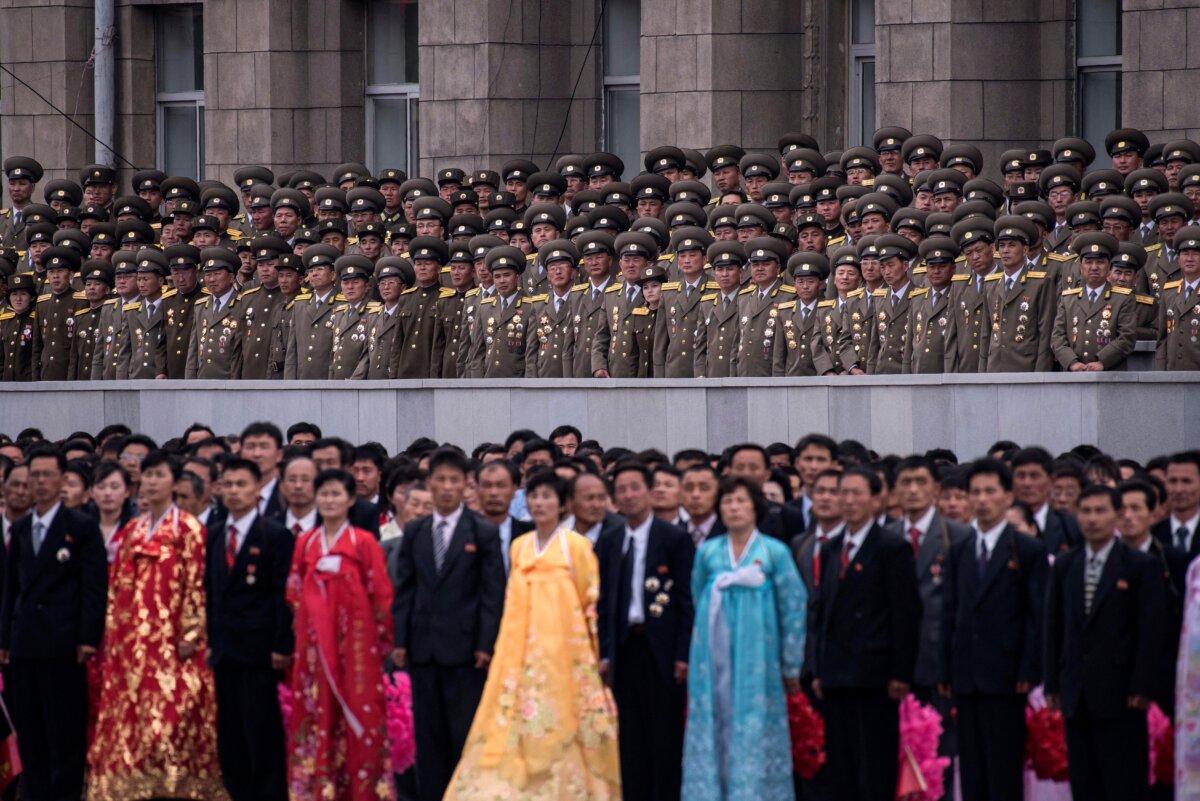 Participants and military personnel look at North Korea's leader during a mass parade marking the end of the 7th Workers Party Congress in Kim Il-Sung square in Pyongyang on May 10, 2016. (Ed Jones/AFP via Getty Images)