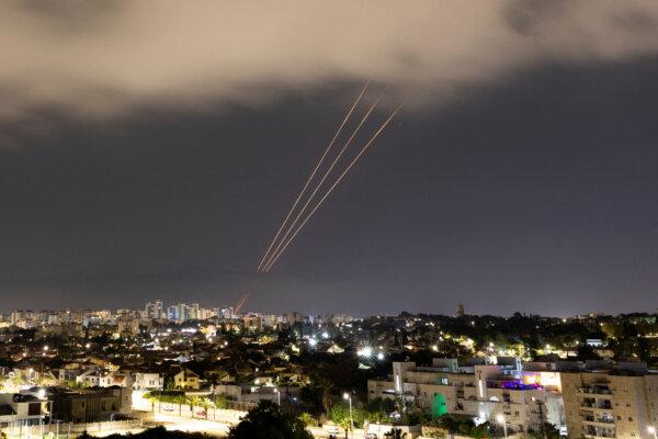 An anti-missile system operates after Iran launched drones and missiles toward Israel, as seen from Ashkelon, Israel, on April 14, 2024. (Amir Cohen/Reuters)