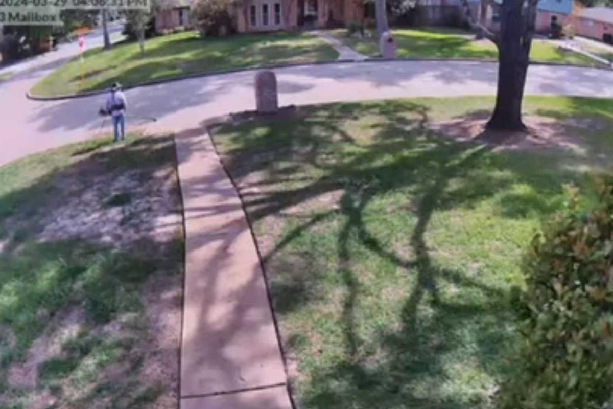 A neighbor's footage shows a lawncare worker watching as the suspects take his equipment. (Courtesy of Harris County Precinct 4 Constable’s Office)