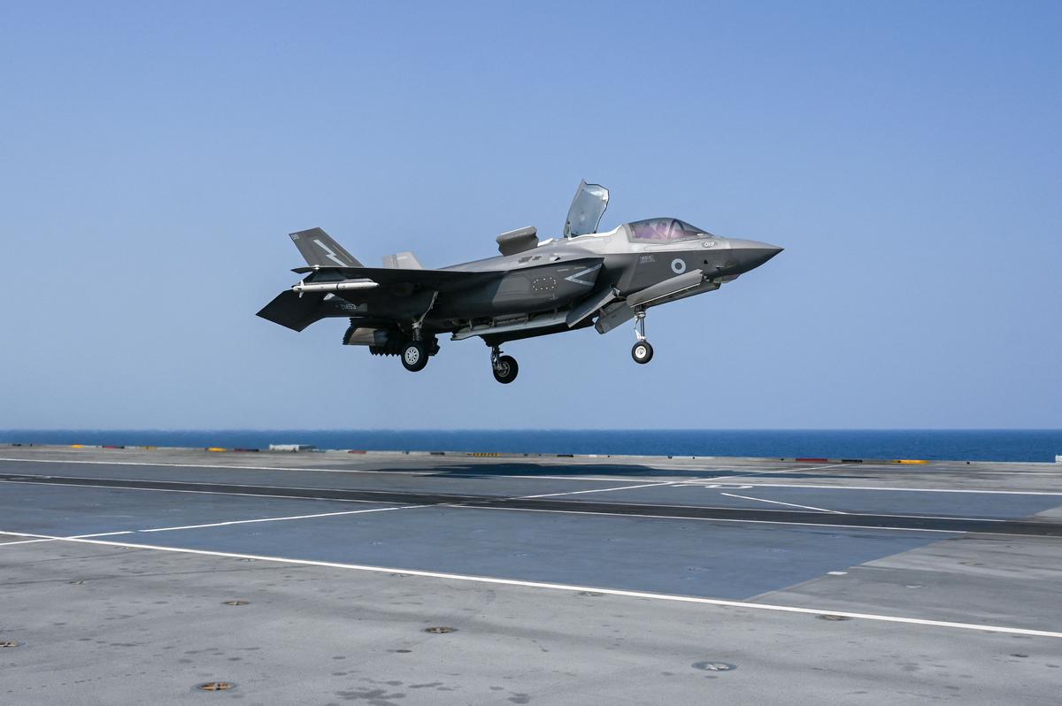 An F-35B fighter jet prepares to land on the flight deck of UK Carrier Strike Group HMS Queen Elizabeth in the Arabian Sea, off the Mumbai coast, on Oct. 21, 2021. (Punit Paranjpe/AFP via Getty Images)