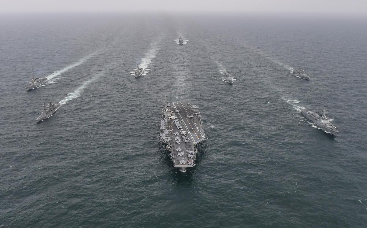 South Korean Navy destroyer Yulgok Yi I (R) U.S. Navy aircraft carrier USS Nimitz (C) and Japan Maritime Self-Defense Force carrier Umigiri, (L) sail in formation during a joint naval exercise in international waters off South Korea's southern island of Jeju on April 4, 2023. (South Korean Defense Ministry via Getty Images)