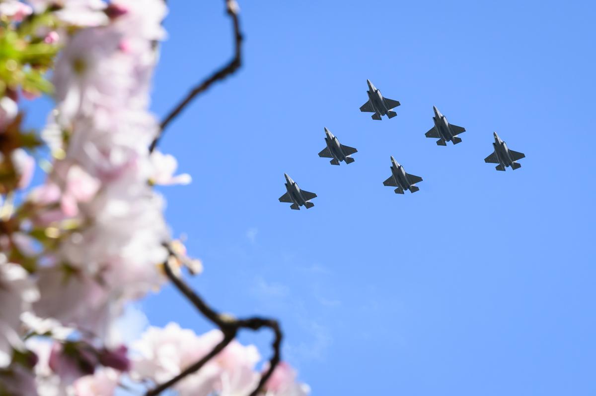 A formation of six F-35B Lightning fighter jets is seen over Royal Air Force College Cranwell, in Sleaford, England, on April 25, 2023. (Leon Neal/Getty Images)