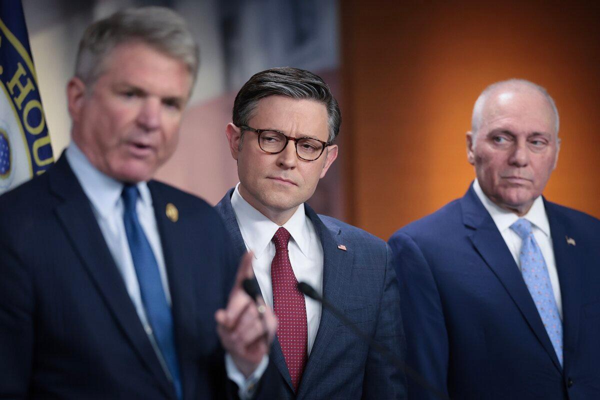 Speaker of the House Mike Johnson (R-La.) (C) listens as Rep. Mike McCaul (R-Texas) (L) speaks during a press conference at the U.S. Capitol in Washington on April 16, 2024. (Win McNamee/Getty Images)