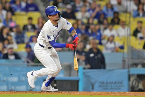 Andy Pages (84) of the Los Angeles Dodgers singles for his first major league hit in the second inning against the Washington Nationals in Los Angeles on April 16, 2024. (Jayne Kamin-Oncea/Getty Images)