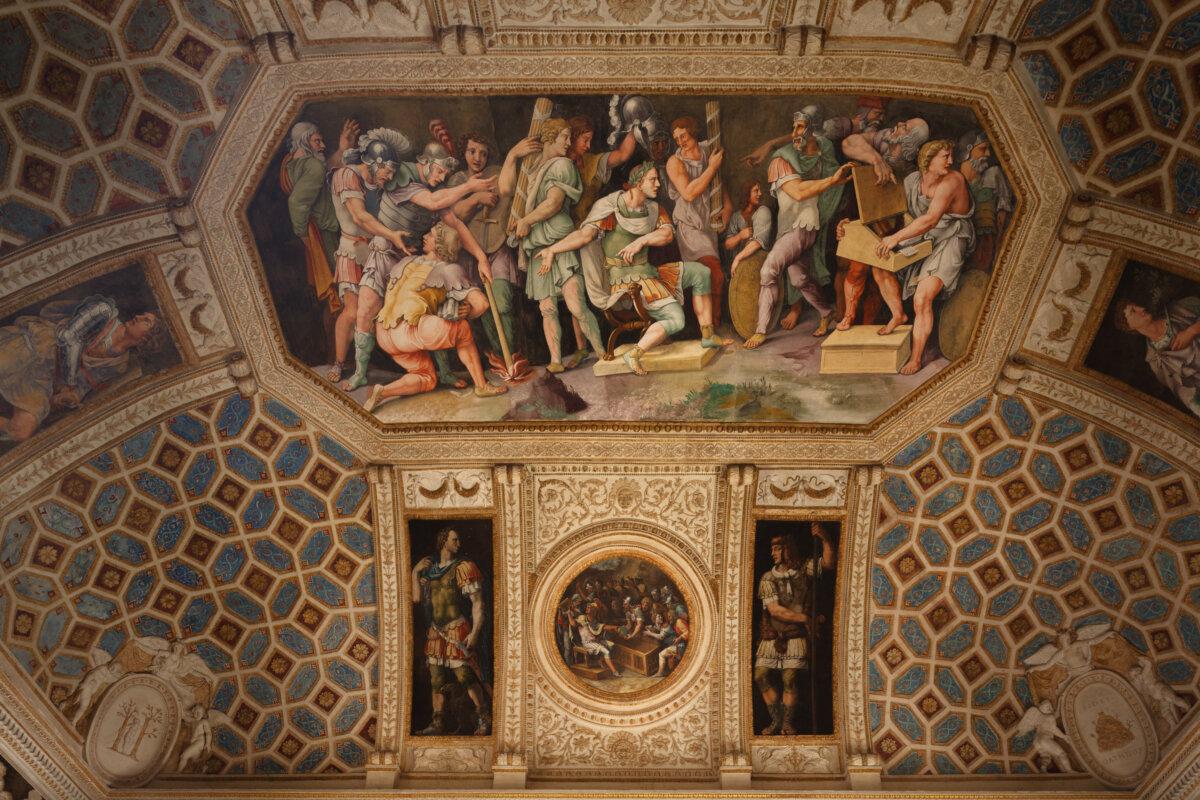 In the Chamber of the Emperors, the ornamented ceiling depicts the rulers and officials of the day as examples of virtue and honor. The central image illustrates a story by Pliny the Elder that tells of Caesar ordering Pompey’s letters to be burned. Caesar had just defeated Pompey and would not read the correspondence. (J.H. Smith)