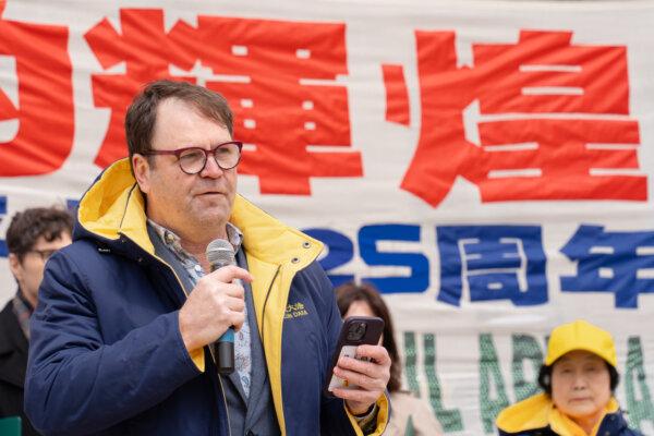 Dean Baxendale, president and publisher of Optimum Publishing International, addresses hundreds of Falun Gong adherents gathered at a rally on the grounds of the Ontario legislature to condemn the Chinese Communist Party's 25 years of repression of the spiritual practice, in Toronto on April 20, 2024. (Jerry Zhang/The Epoch Times)