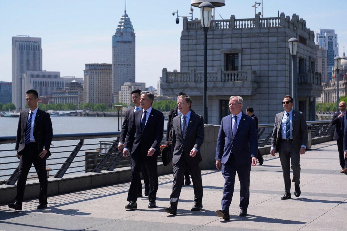 U.S. Secretary of State Antony Blinken (3rd L), U.S. Ambassador to China Nicholas Burns (C), and Consul General at the U.S. Consulate General in Shanghai Scott Walker (3rd R) walk along the Bund in Shanghai on April 25, 2024. (Mark Schiefelbein/POOL/AFP via Getty Images)