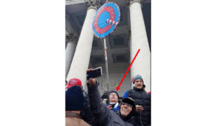 Woman Who Held ‘Q’ Sign on Jan. 6 Convicted by Jury