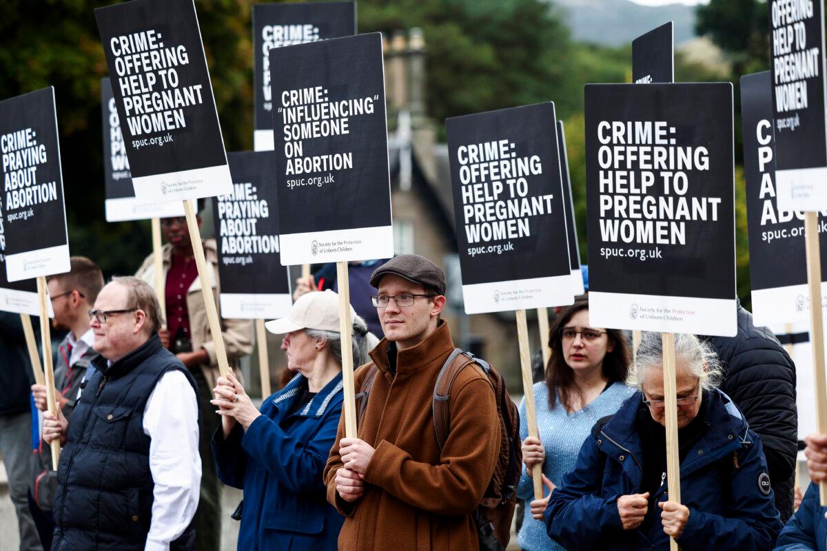 Demonstrators hold an