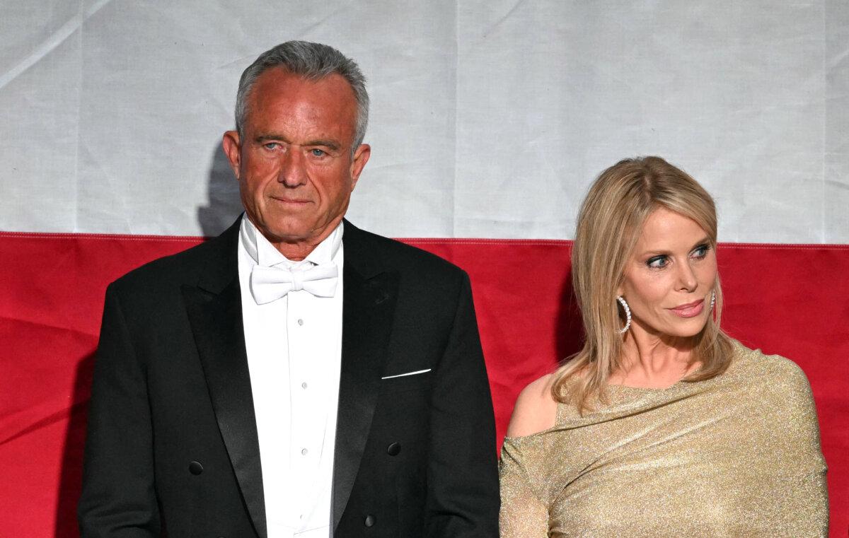 U.S. politician Robert F. Kennedy Jr. and his wife actress Cheryl Hines attend the 79th Annual Alfred E. Smith Memorial Foundation Dinner with President Donald Trump at the Hilton Midtown in New York, Oct. 17, 2024. (Photo by Timothy A. CLARY / AFP)