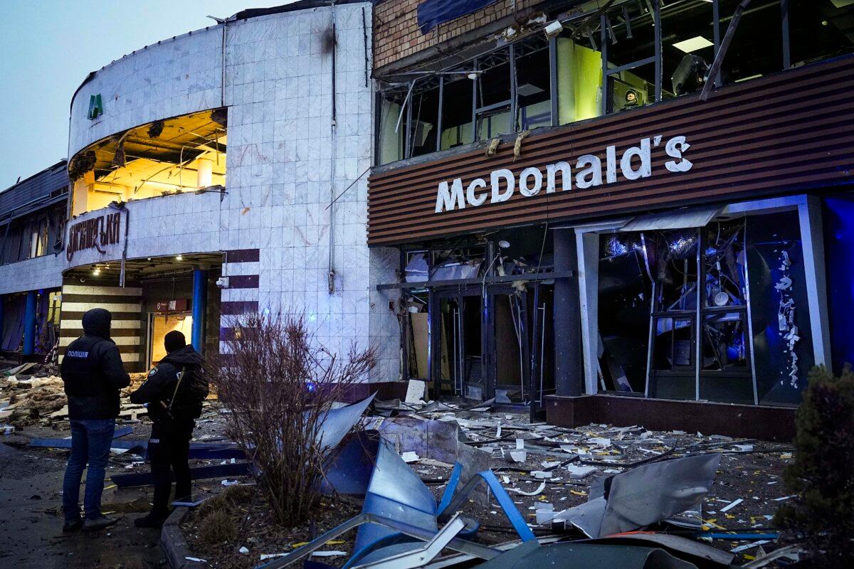 Police officers guard a building after a Russian missile attack in Kyiv on Jan. 18, 2025. (Efrem Lukatsky/AP Photo)