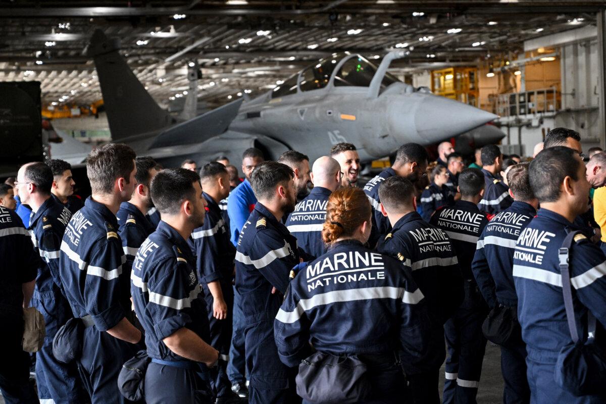 The crew waits for France's Defence Minister Sebastien Lecornu onboard the aircraft carrier Charles de Gaulle in Lembar, Lombok, Indonesia on Feb. 1, 2025. (Sonny Tumbelaka/AFP via Getty Images)