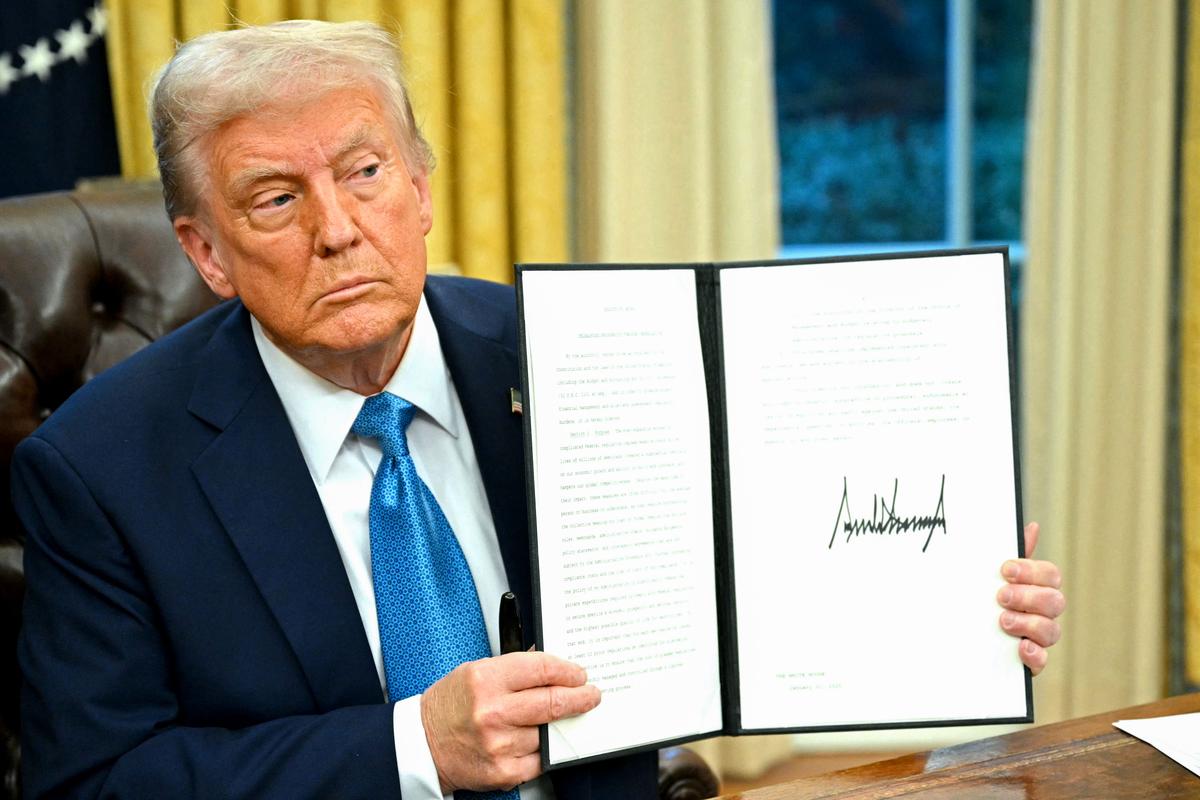 President Donald Trump speaks to the press after signing an executive order in the Oval Office of the White House on Jan. 31, 2025. (Mandel Ngan/AFP via Getty Images)