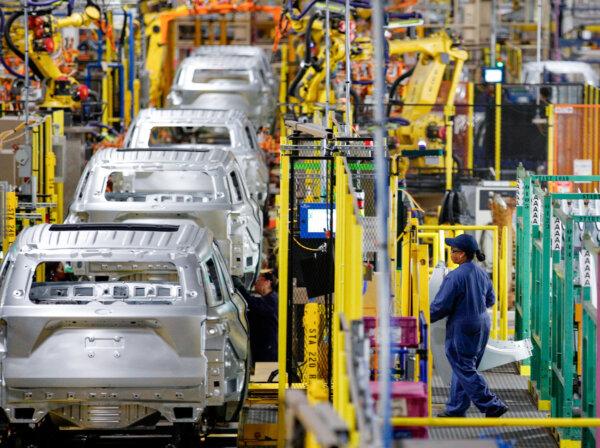 Workers assemble cars at Ford's Assembly Plant in Chicago on June 24, 2019. (Jim Young/AFP via Getty Images)