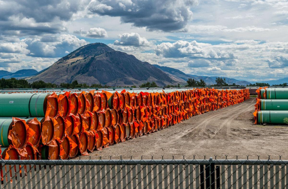 Steel pipe to be used in the oil pipeline construction of the Canadian government’s Trans Mountain Expansion Project lies at a stockpile site in Kamloops, B.C., on June 18, 2019. (Dennis Owen/Reuters)