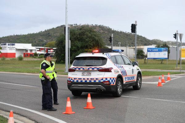 Police are seen directing traffic at the scene of the car accident involving teenagers in Townsville, Australia, on June 07, 2020. (Ian Hitchcock/Getty Images)