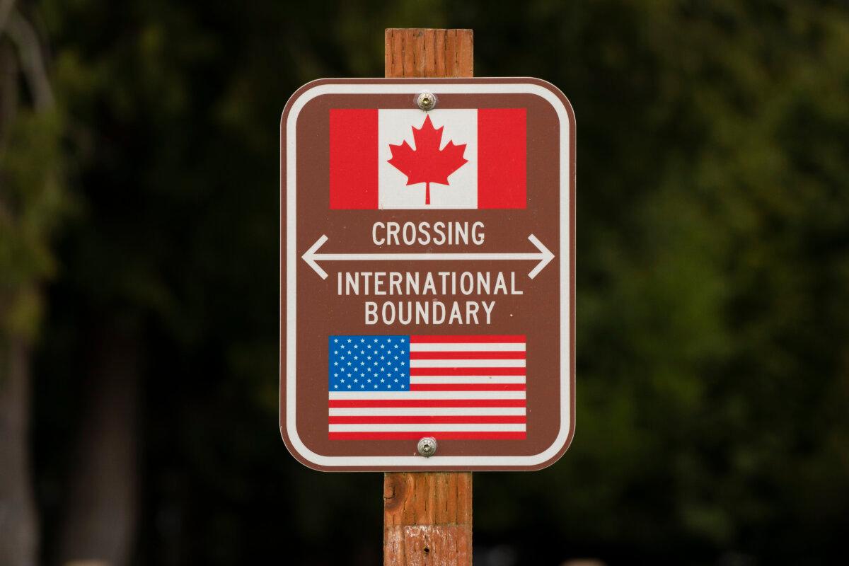 A sign marks the border between the United States and Canada at Peace Arch Park, in Blaine, Wash., on Feb. 1, 2025. (David Ryder/Getty Images)