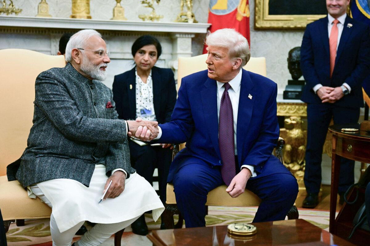 President Donald Trump shakes hands with Indian Prime Minister Narendra Modi during a meeting in the Oval Office, on Feb. 13, 2025. (Jim Watson/AFP via Getty Images)