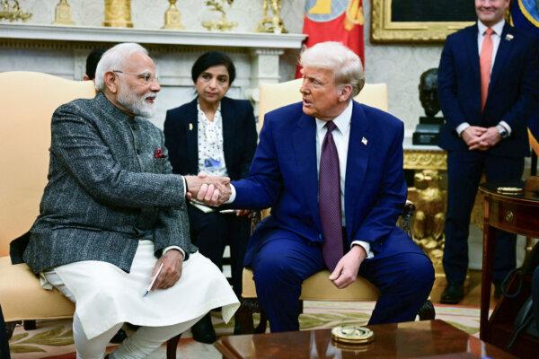 President Donald Trump shakes hands with Indian Prime Minister Narendra Modi during a meeting in the Oval Office, on Feb. 13, 2025. (Jim Watson/AFP via Getty Images)