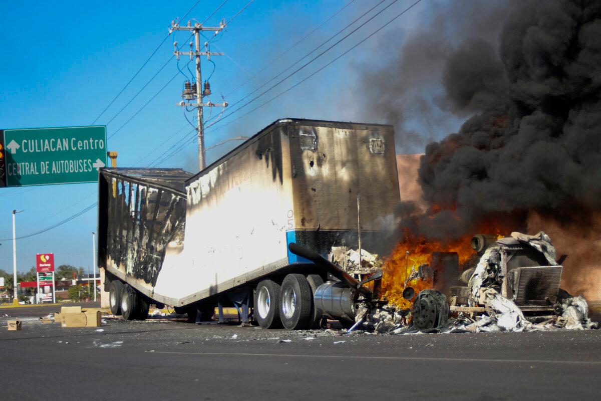 A truck burns on a street in Culiacan, Sinaloa state, Mexico, on Jan. 5, 2023, after security forces captured Ovidio Guzmán, a son of former Sinaloa cartel boss Joaquín