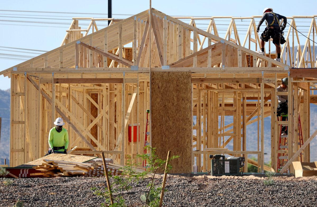 Workers construct a new home at a master-planned residential community in Buckeye, Ariz., on June 8, 2023. (Mario Tama/Getty Images)