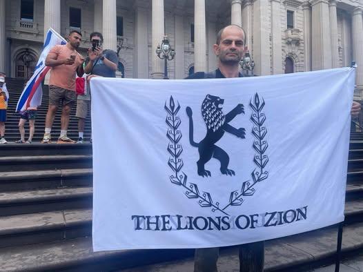 Lions of Zion organiser Yaacov Travitz on the steps of Victoria's state parliament building in Melbourne, Australia. (Josh Spasaro/The Epoch Times)