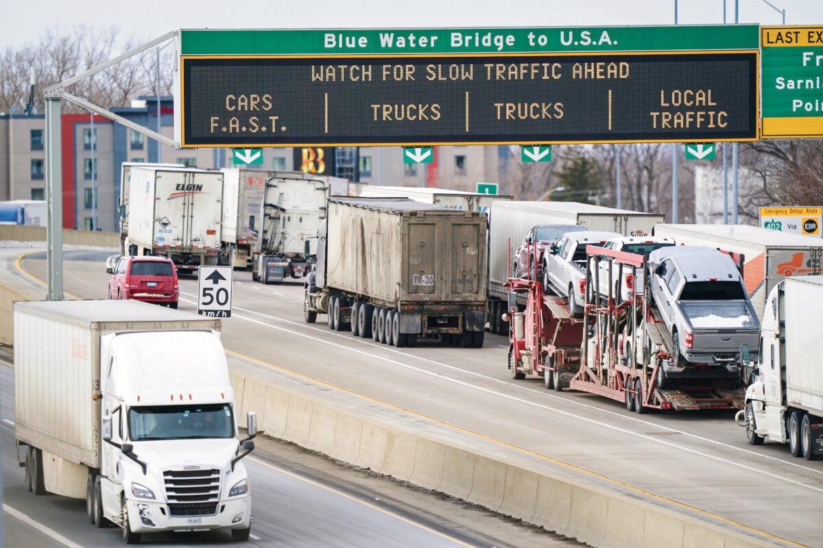 Trucks wait to cross the Bluewater Bridge border-crossing between Sarnia, Canada, and Port Huron, Mich., on Jan. 29, 2025. (Geoff Robins/AFP via Getty Images)