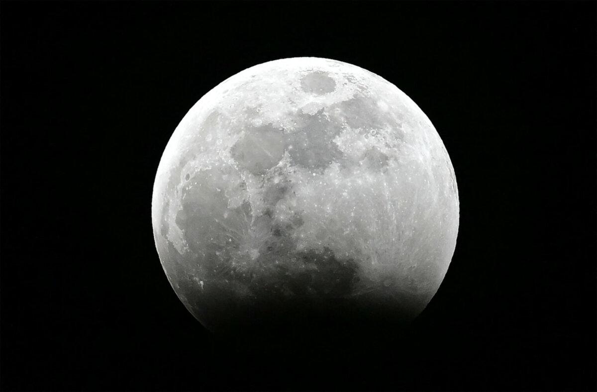 The moon as the umbral eclipse begins during the Blood Moon Lunar Eclipse above Los Angeles on March 13, 2025. (Frederic J. Brown/AFP via Getty Images)