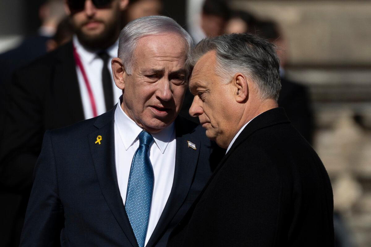 Israeli Prime Minister Benjamin Netanyahu (L) and Hungarian Prime Minister Viktor Orban (R) talk after a welcoming ceremony with a guard of honor at Buda Castle in Budapest, Hungary, on Thursday, April 3, 2025. (Denes Erdos/AP Photo)