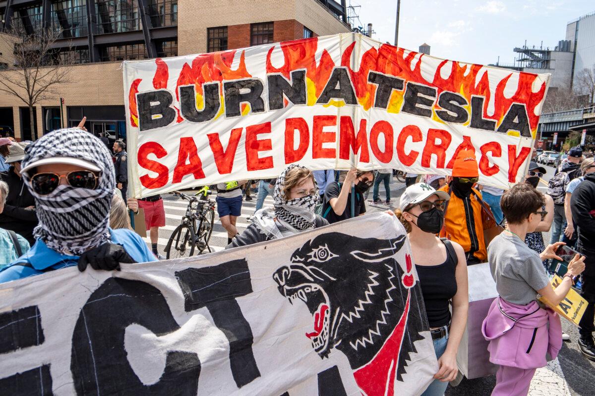 People take part in a protest against Tesla in New York City on March 29, 2025. (Samira Bouaou/The Epoch Times)