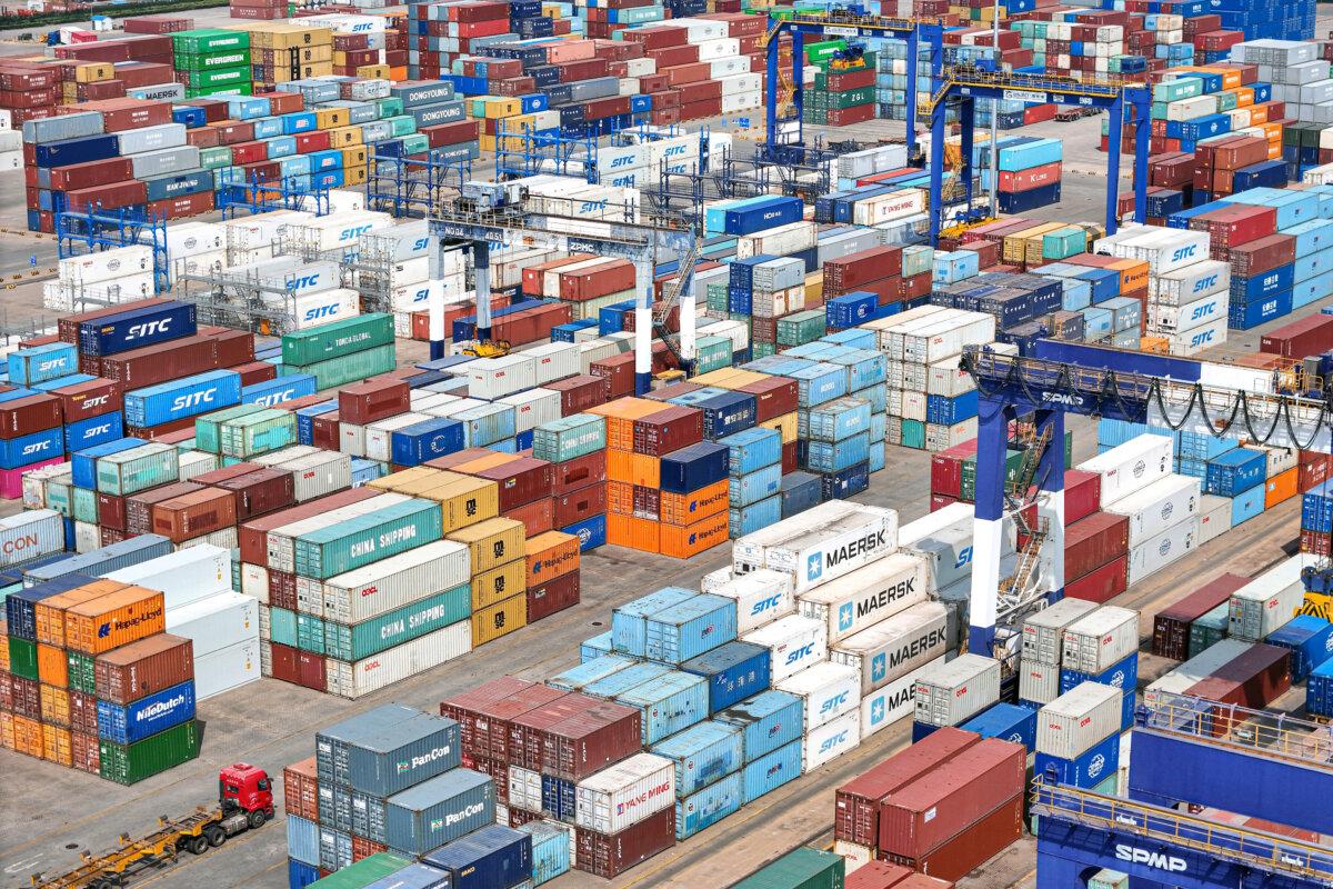 Shipping containers are stacked at a port in Yantai, in eastern China's Shandong province on April 3, 2025. (AFP)
