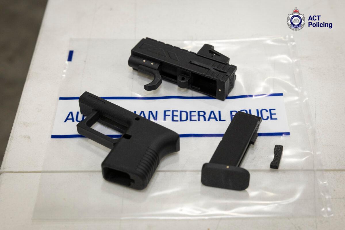 The 3D-printed gun that ACT Police seized is seen taken apart. (ACT Police)