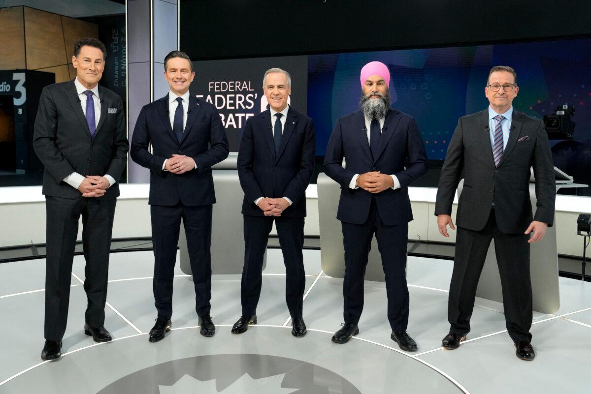 (L-R) Debate moderator Steve Paikin, Conservative Leader Pierre Poilievre, Liberal Leader Mark Carney, NDP Leader Jagmeet Singh, and Bloc Quebecois Leader Yves-Francois Blanchet pose for a group photo ahead of the English-language leaders' debate in Montreal on April 17, 2025. (Adrian Wyld/Pool/AFP via Getty Images)