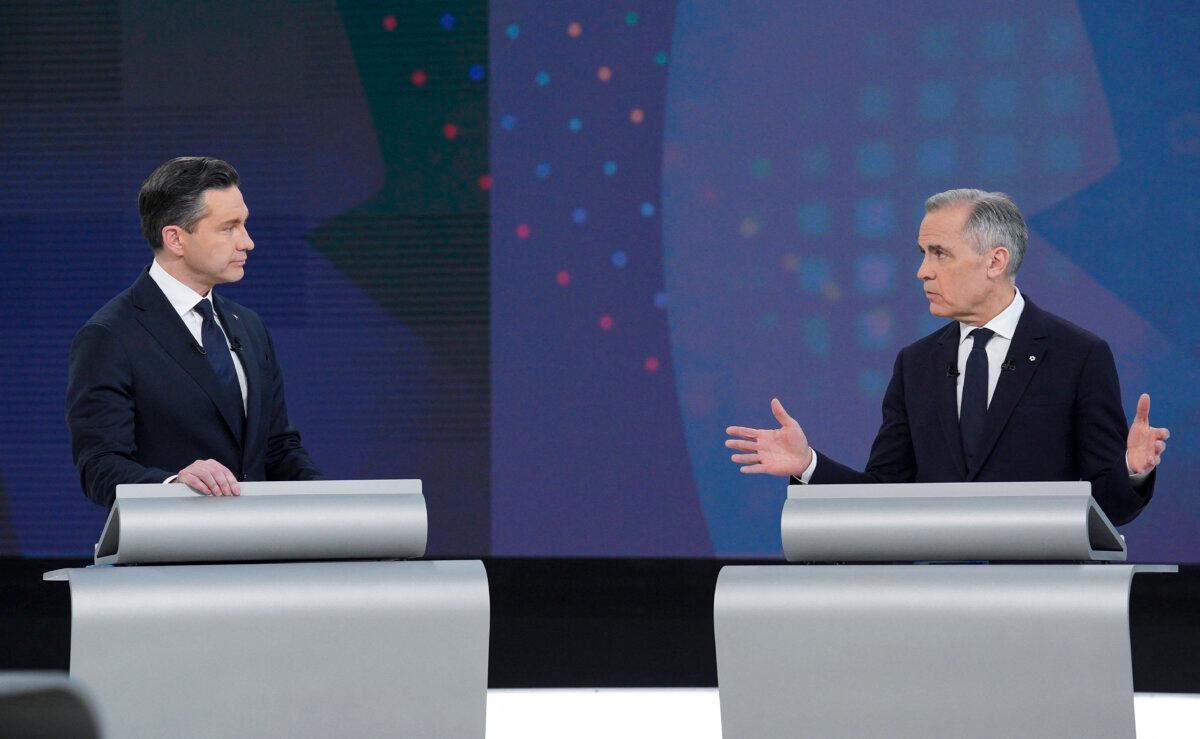 Conservative Leader Pierre Poilievre (L) and Liberal Leader Mark Carney speak during the English-language leaders' debate in Montreal on April 17, 2025. (Christopher Katsarov/Pool/AFP via Getty Images)