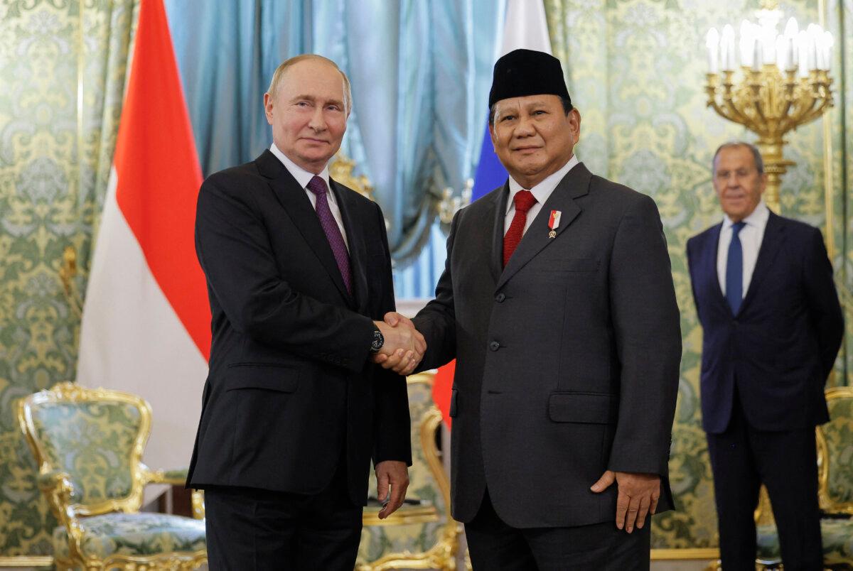 Russia's President Vladimir Putin (L) shakes hands with Indonesia's President Prabowo Subianto (R) in Moscow, Russia, on July 31, 2024. (Maxim Shemetov/POOL/AFP via Getty Images)